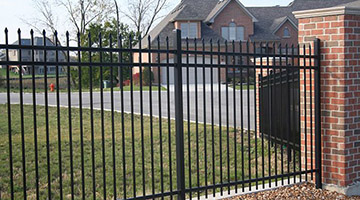 steel picket fence against wall