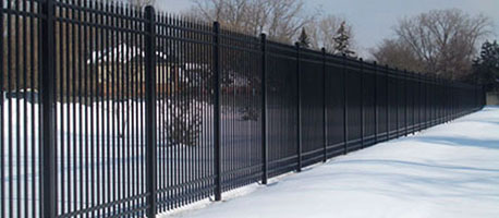 steel picket fence in snow