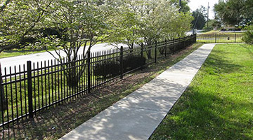 steel picket fence next to street